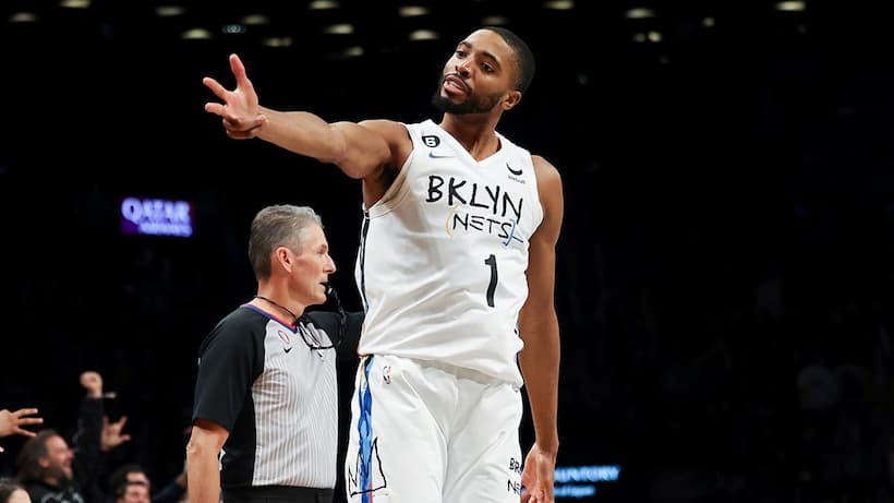 Mikal Bridges on fire as he celebrates to the crowd after hitting another three pointer