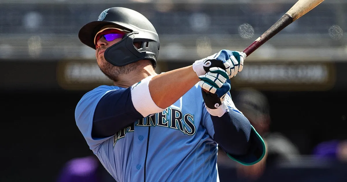 Ty France swings during a Spring Training game for the Seattle Mariners.