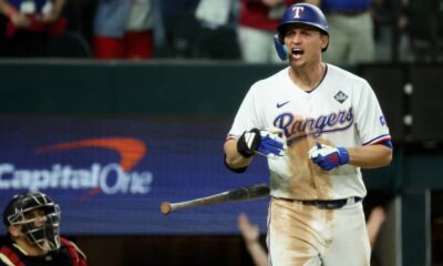 Corey Seager celebrates hitting a home run in the ninth inning of Game One of the 2023 World Series for the Texas Rangers.