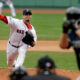Josh Beckett pitches at home for the Boston Red Sox against the Seattle Mariners.
