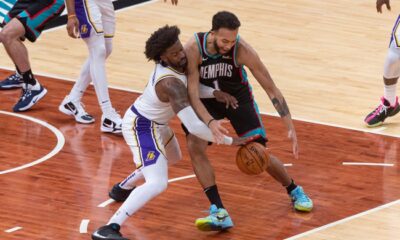 Wesley Matthews and Kyle Anderson struggle for a loose ball.