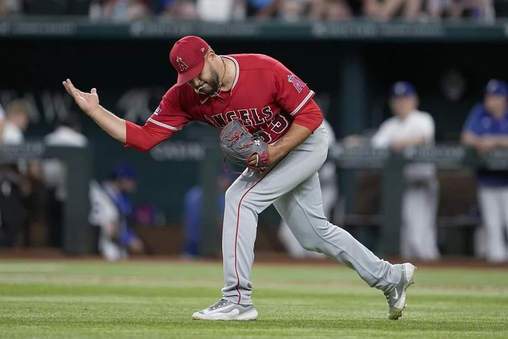 Carlos Estevez celebrates a win for the Los Angels Angels over the Texas Rangers at Globe Life Field.