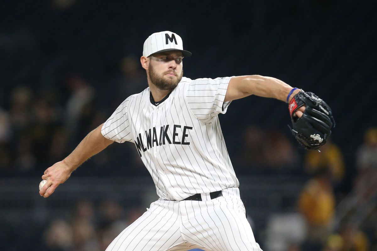 Adrian Houser pitches at home for the Milwaukee Brewers.