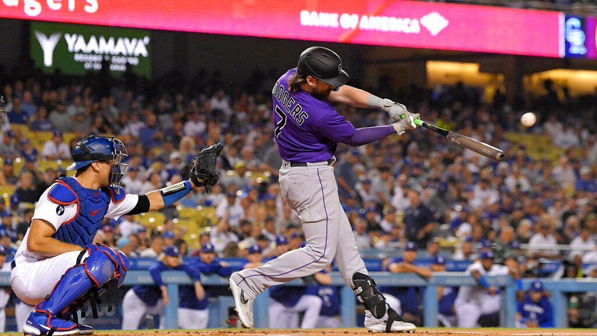 Brendan Rodgers hits a home run for the Colorado Rockies on the road against the Los Angeles Dodgers.