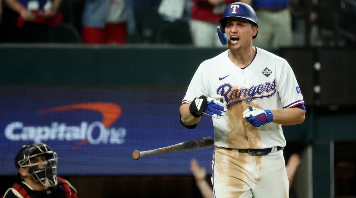 Corey Seager celebrates hitting a home run in the ninth inning of Game One of the 2023 World Series for the Texas Rangers.