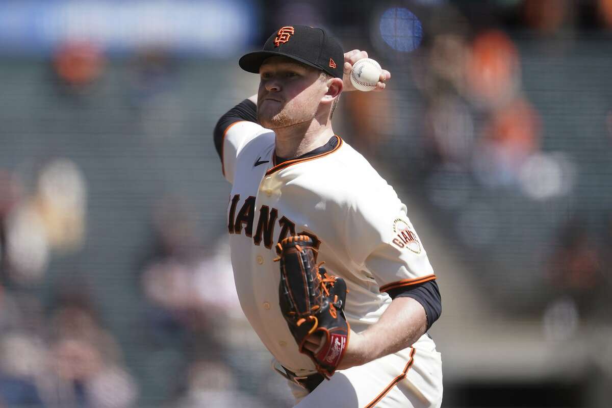 Logan Webb pitches at home for the San Francisco Giants.