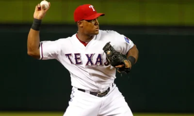 Adrian Beltre throws to first base while playing for the Texas Rangers.