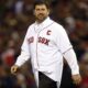 Jason Varitek walks to the mound while being honored at Fenway Park.