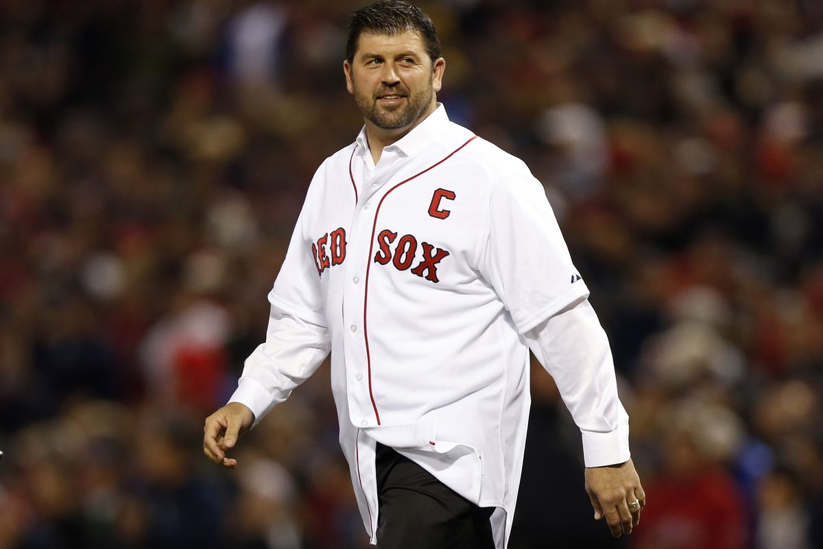Jason Varitek walks to the mound while being honored at Fenway Park.