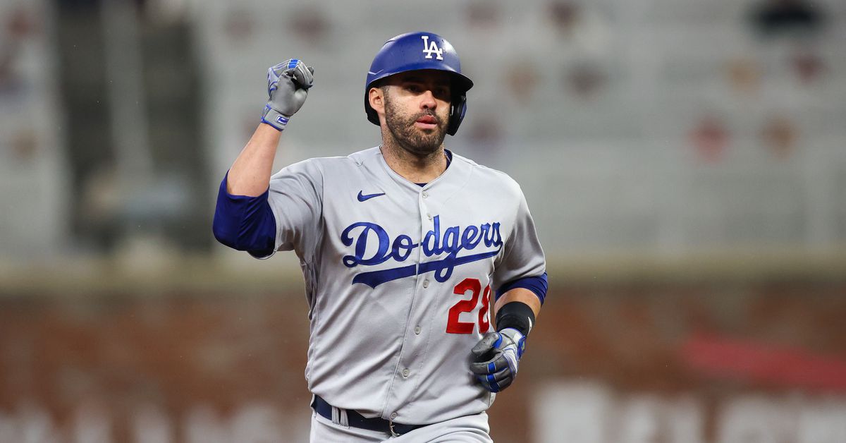 JD Martinez celebrates hitting a home run for the Los Angeles Dodgers during a road game.