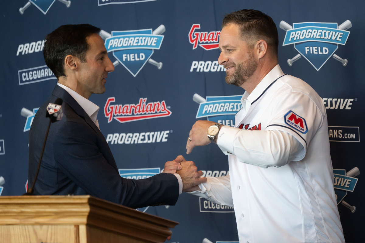 Stephen Vogt embraces Chris Antonetti during his introductory press conference.