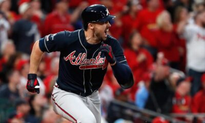 Adam Duvall celebrates while playing for the Atlanta Braves.