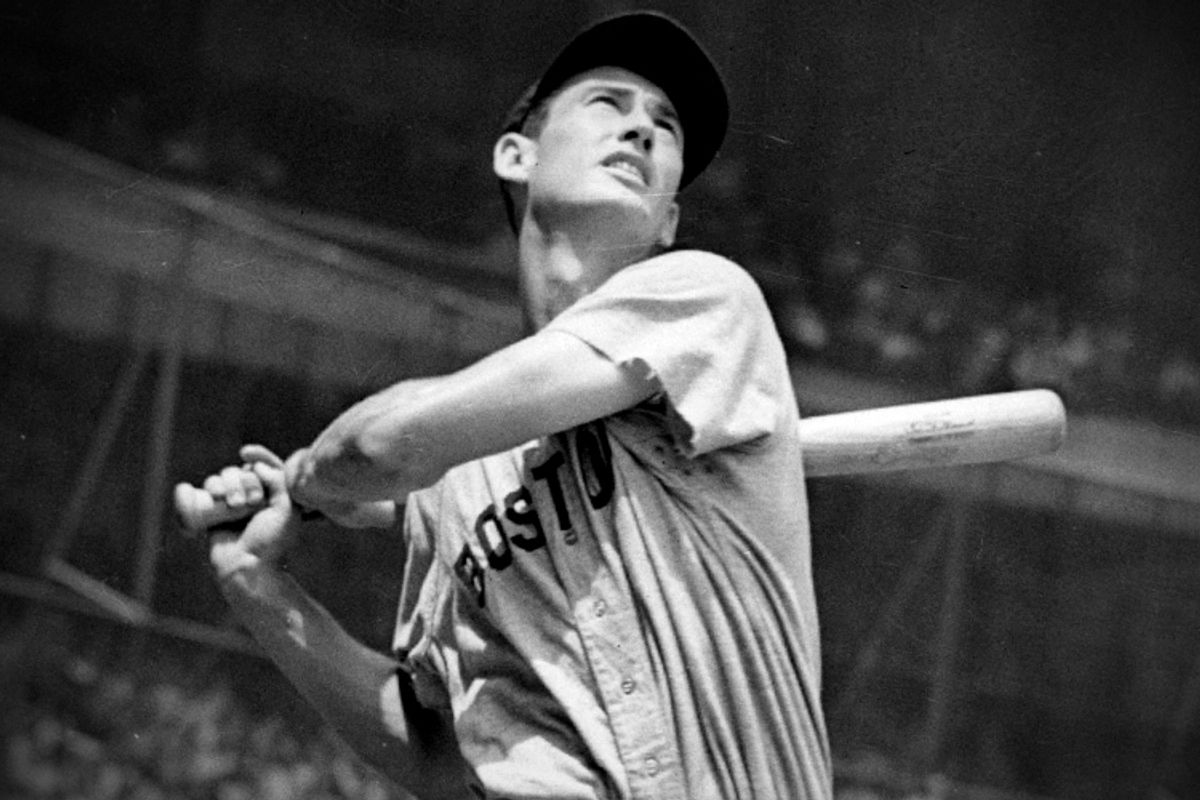 Ted Williams swings during a game for the Boston Red Sox.