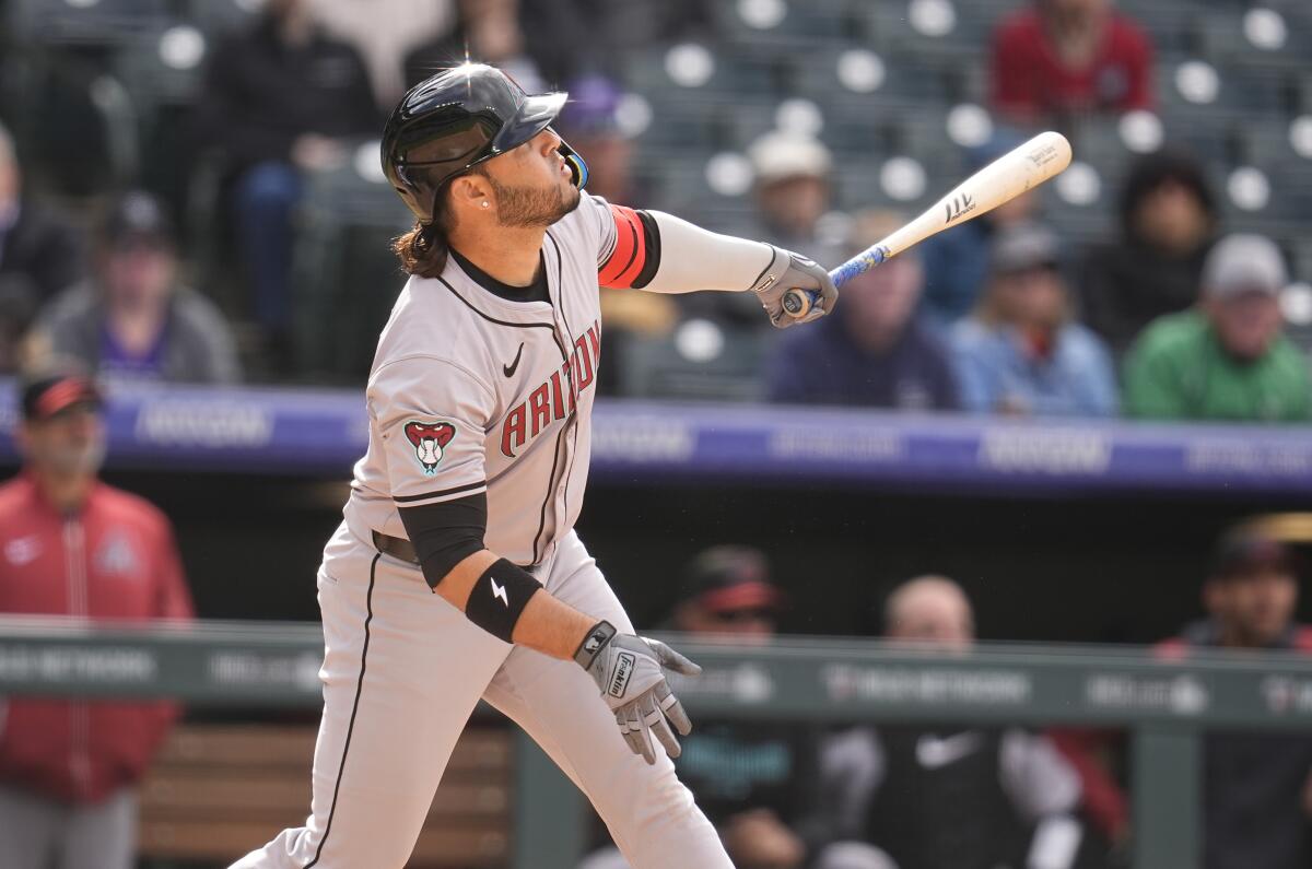 Eugenio Suarez hits a double for the Arizona Diamondbacks against the San Diego Padres.
