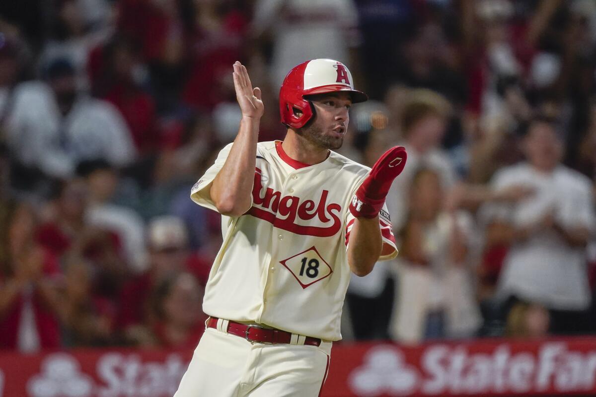 Nolan Schanuel celebrates after scoring a run for the Los Angeles Angels.