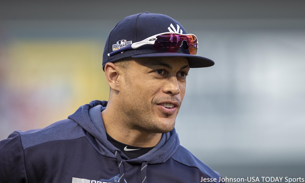 Giancarlo Stanton warms up before a playoff game for the New York Yankees.