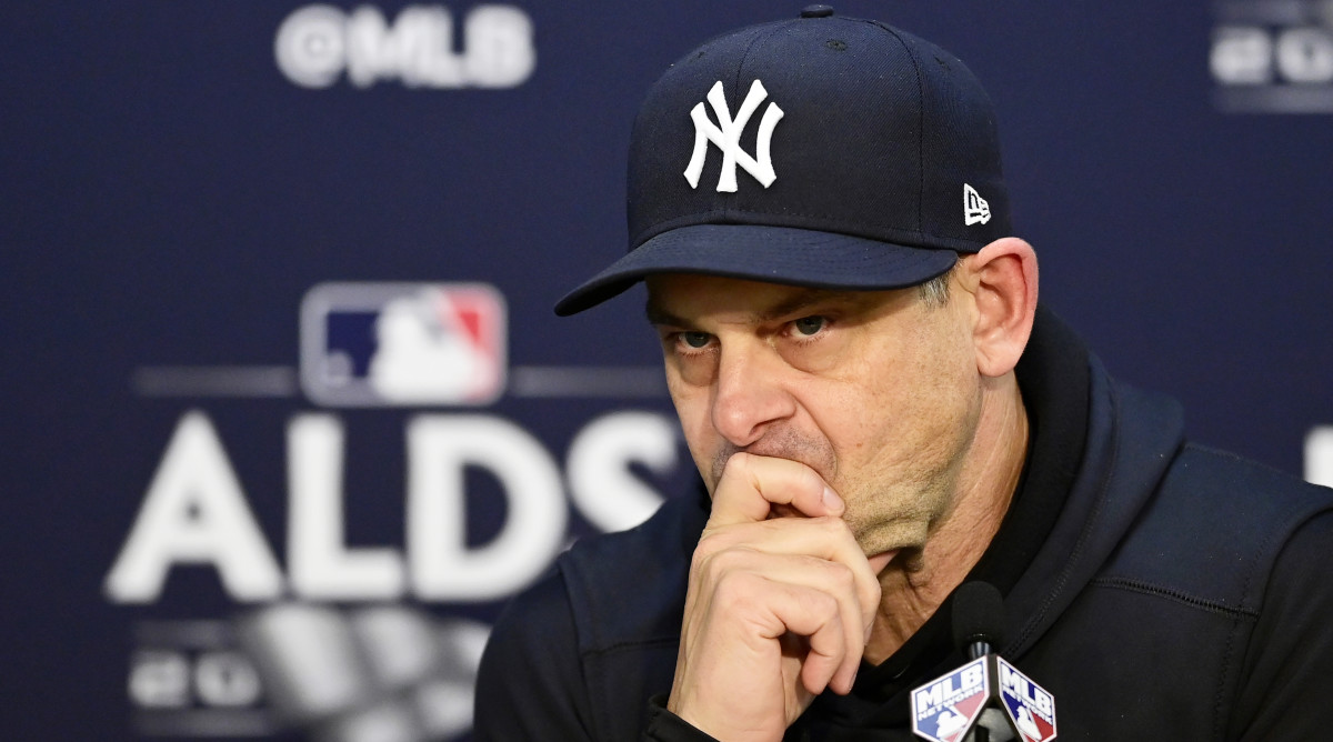 Aaron Boone sits at a press conference during the 2022 MLB Postseason.