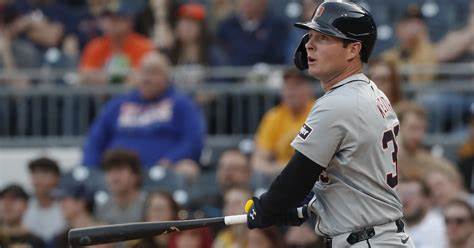 Colt Keith admires the ball during a road game for the Detroit Tigers.