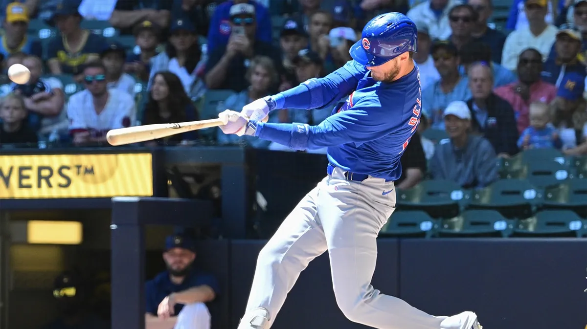 Cody Bellinger swings while playing for the Chicago Cubs.