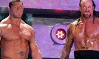 Undertaker and Batista look on before their match at Wrestlemania 23.