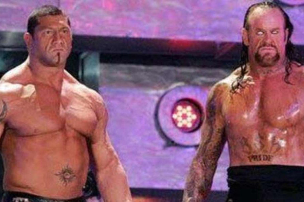 Undertaker and Batista look on before their match at Wrestlemania 23.