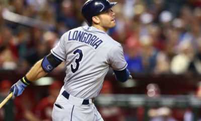 Evan Longoria swings while playing on the road for the Tampa Bay Rays.
