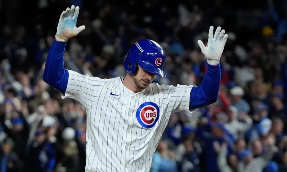 Kyle Tucker celebrates hitting a home run at home for the Chicago Cubs.