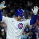Kyle Tucker celebrates hitting a home run at home for the Chicago Cubs.