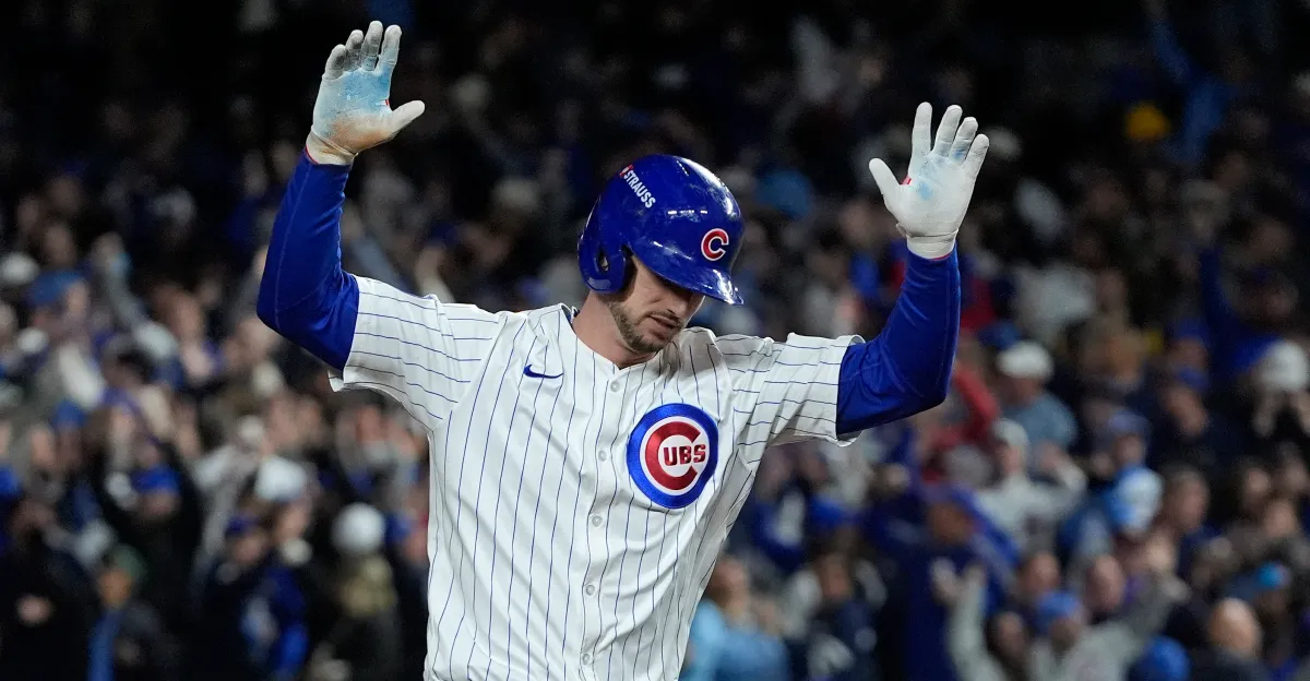 Kyle Tucker celebrates hitting a home run at home for the Chicago Cubs.