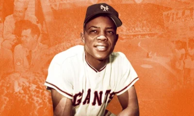Willie Mays takes a knee while playing for the San Francisco Giants.