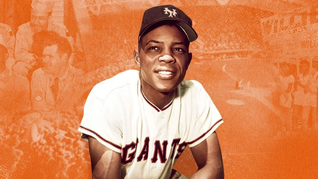 Willie Mays takes a knee while playing for the San Francisco Giants.