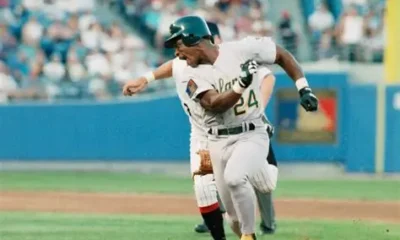 Rickey Henderson evades a tag while playing for the Oakland A's.