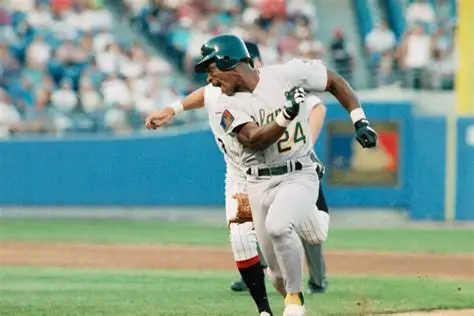 Rickey Henderson evades a tag while playing for the Oakland A's.