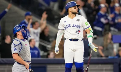 Bo Bichette watches the ball after hitting a home run during Game 7 of the 2025 World Series.